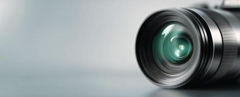 A camera lens is shown on a gray background photo