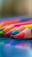Colorful pencils on a blue surface photo