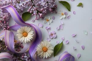 Lilac flowers and ribbon on white background photo
