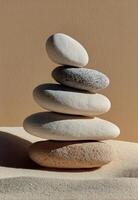 A stack of stones sitting on top of sand photo