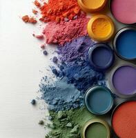 Colorful paint and paint brushes on white background photo