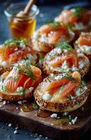 Smoked salmon on bagels with honey and dill photo