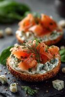 Smoked salmon on bagel with cream cheese and herbs photo
