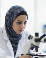 Muslim Scientist Using Microscope in Lab photo