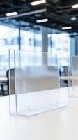 Transparent Acrylic Barriers on White Surface in Modern Office Interior with Blurred Background photo
