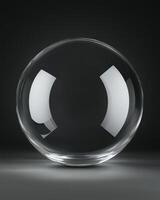 Transparent Glass Sphere Reflecting Light Against Dark Gray Background photo