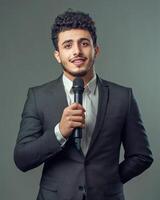 Confident Young Man in Suit Holding Microphone, Ready to Speak, Public Speaking, Presentation, Interview, Announcer, Businessman, Speaker, News Reporter, Podcast Host photo