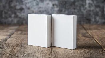 Two White Rectangular Objects On Textured Wooden Surface Against Gray Background photo