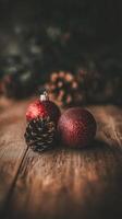 Christmas Ornaments with Pinecone on Rustic Wood. photo