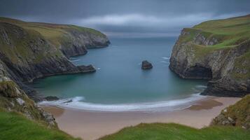 Serene Coastal Bay With Sandy Beach And Dramatic Cliffs photo