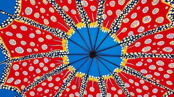 Close Up Red Blue Umbrella Pattern Abstract Geometric Textile Design photo