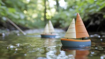 Miniature Sailboats Floating on a Calm Forest Stream photo