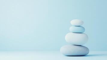 Stones stack for calm on blue backdrop photo