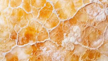 Unique patterns in orange natural stone surface photo