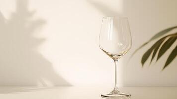 Elegant wine glass on table with shadows photo