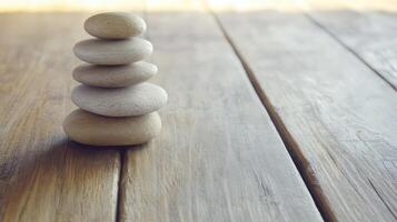 Stacked stones create a calm focal point on wood photo