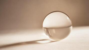 Crystal sphere on a soft surface creating shadows photo