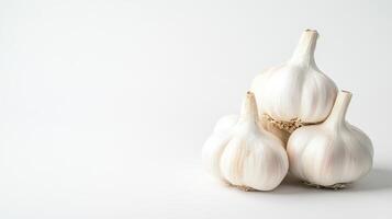 Garlic bulbs stacked on a clean surface photo