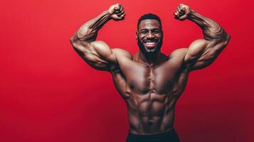 Strong man flexing muscles against a red backdrop photo