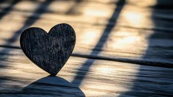 Light and shadow create a heart shape on wood photo