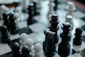 Detailed view of chess pieces on a board, showcasing strategy and competition in a classic game setting. photo