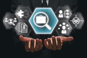 Businessman showcasing digital icons representing job hunting and career opportunities in a modern, tech-driven environment. photo