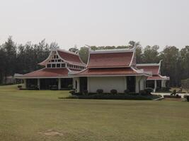Stunning ThaiStyle Architecture Enveloped by Beautiful and Lush Greenery All Around photo