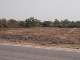 Cleared Area of Land Adjacent to a Roadside Prepared for Future Development Projects photo