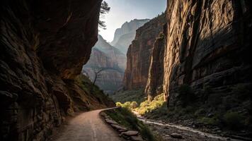 narrow canyon passage with towering rock formations and winding path. sunlight filters through, illuminating lush greenery along riverbank, creating serene and majestic atmosphere photo