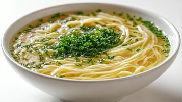 Bowl of comforting broth noodles photo