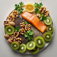 salmon, walnuts, kiwi, and almonds on a plate photo