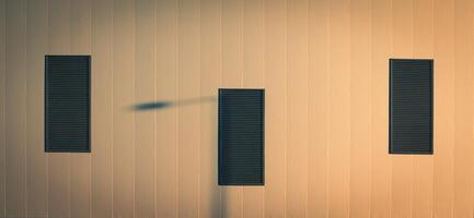 Symmetrical architectural background playing with three windows photo