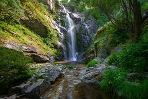 Contemplating the light playing with the water and the majesty of the Toxa waterfall photo