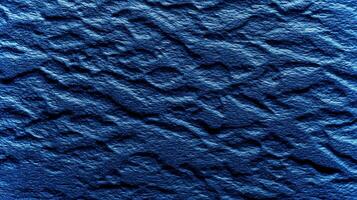 This textured blue backdrop features organic patterns that create depth and interest, ideal for eco-focused designs or mockup presentations in various styles. photo