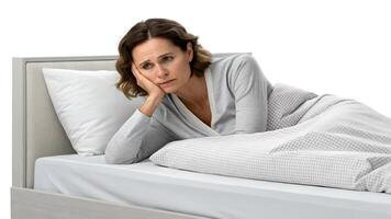 Worried Woman Lying in Bed with Sad Expression Thinking photo
