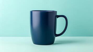 Dark Blue Mug on Light Green Background photo