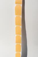 Blank beige sticky notes on white background photo
