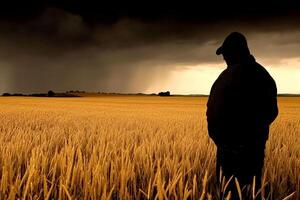 A man standing in a field with a storm in the background photo