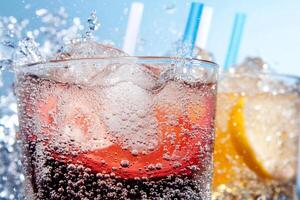 Two glasses of soda with ice and lemon slices photo