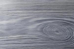 A close up of a wooden surface with a circular pattern photo