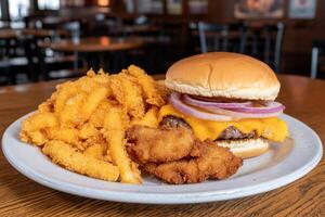 A plate with a burger and fries on it photo