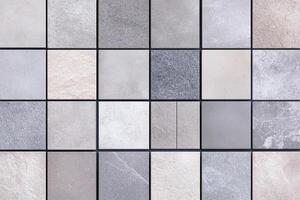 A large collection of gray and white tiles photo