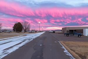 A pink sky with clouds photo