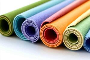 A group of colorful rolled up yoga mats photo