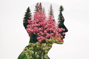 A double exposure of a man's head with trees and flowers photo