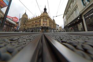 A view of a train track with a building in the background photo
