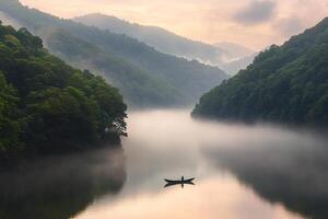 A man in a boat on a river surrounded by trees photo