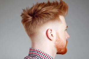A man with red hair and a mohawk photo