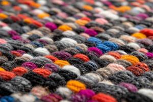 A close up of a colorful rug with many different colors photo