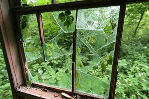 Broken window in abandoned building photo
